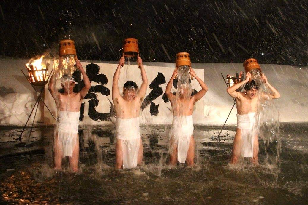 Locals brave the cold in the Fujikoto River.