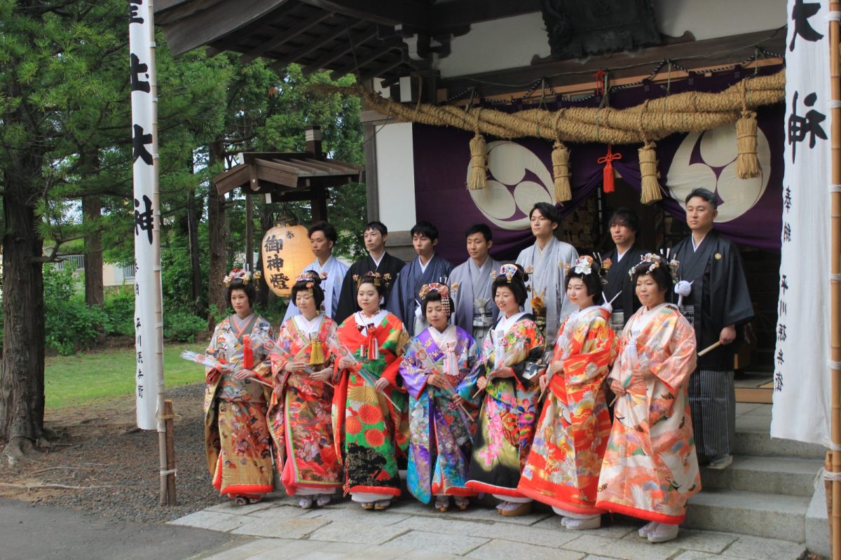 Newlyweds pose for photos at Hiyoshi Shrine.